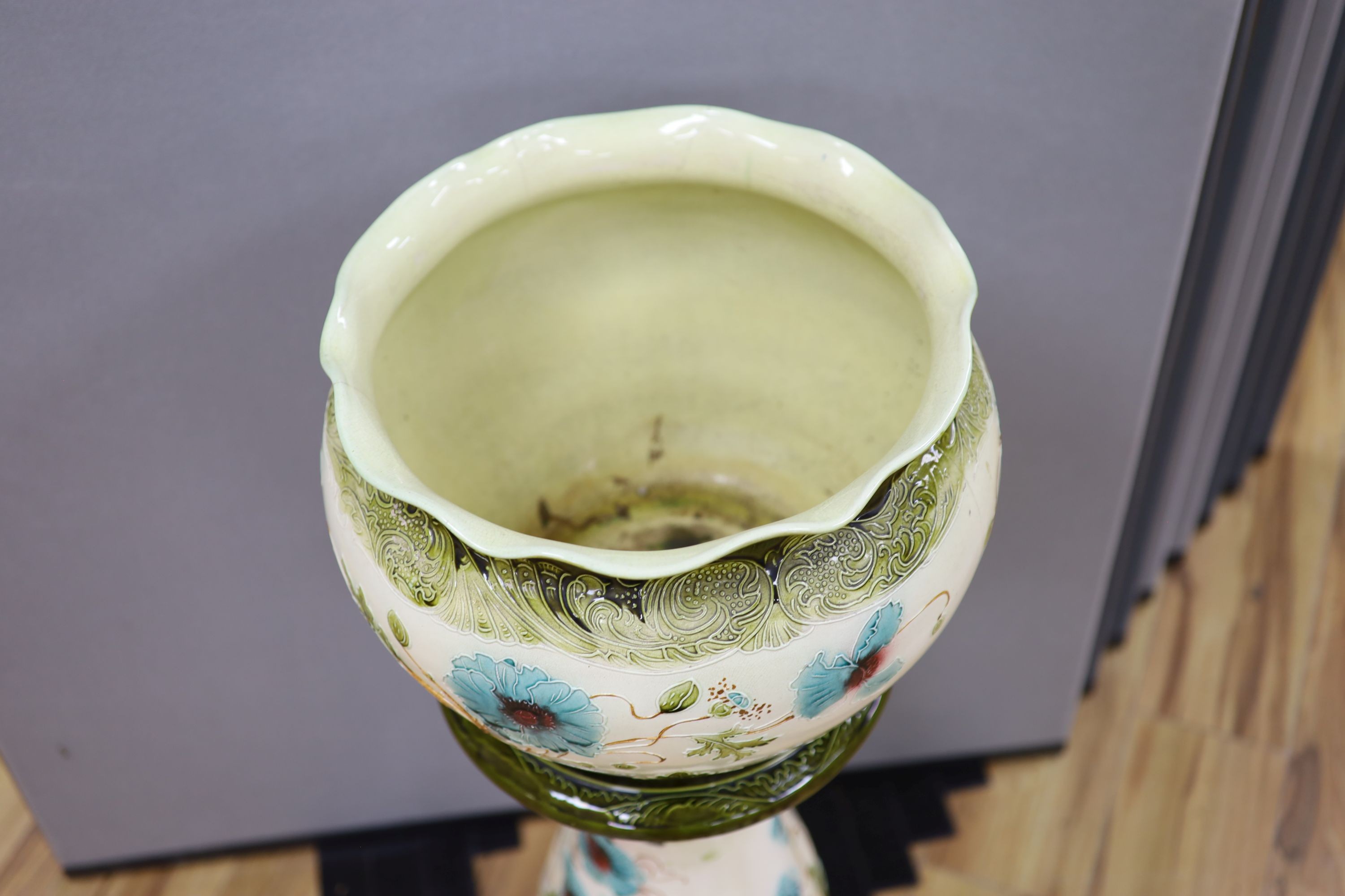 A Burmantofts style 'poppy' jardiniere and stand, total height 96 cm